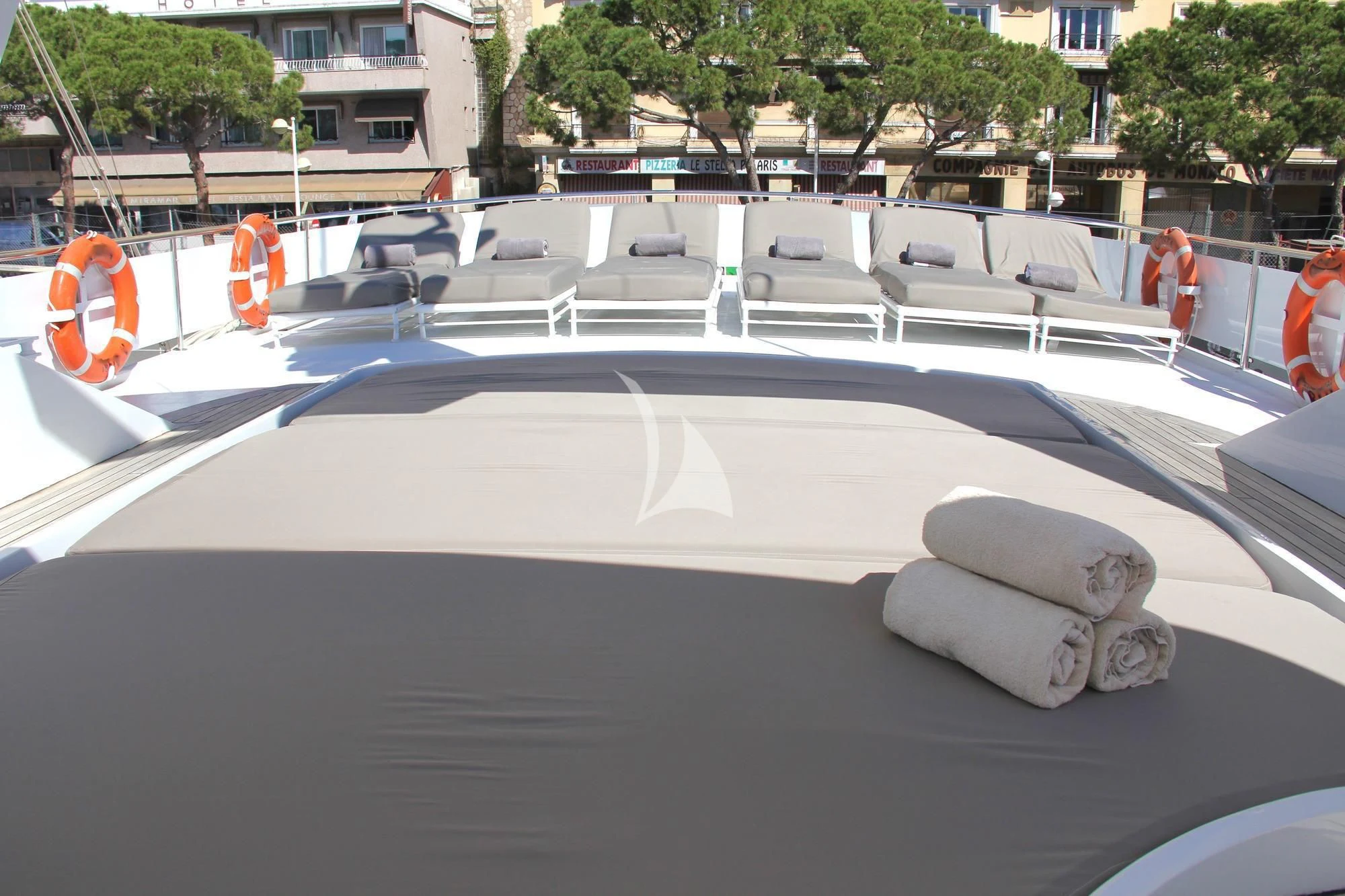 a large white pool with a large white roof and a few people walking around it aboard COSTA MAGNA Yacht for Sale