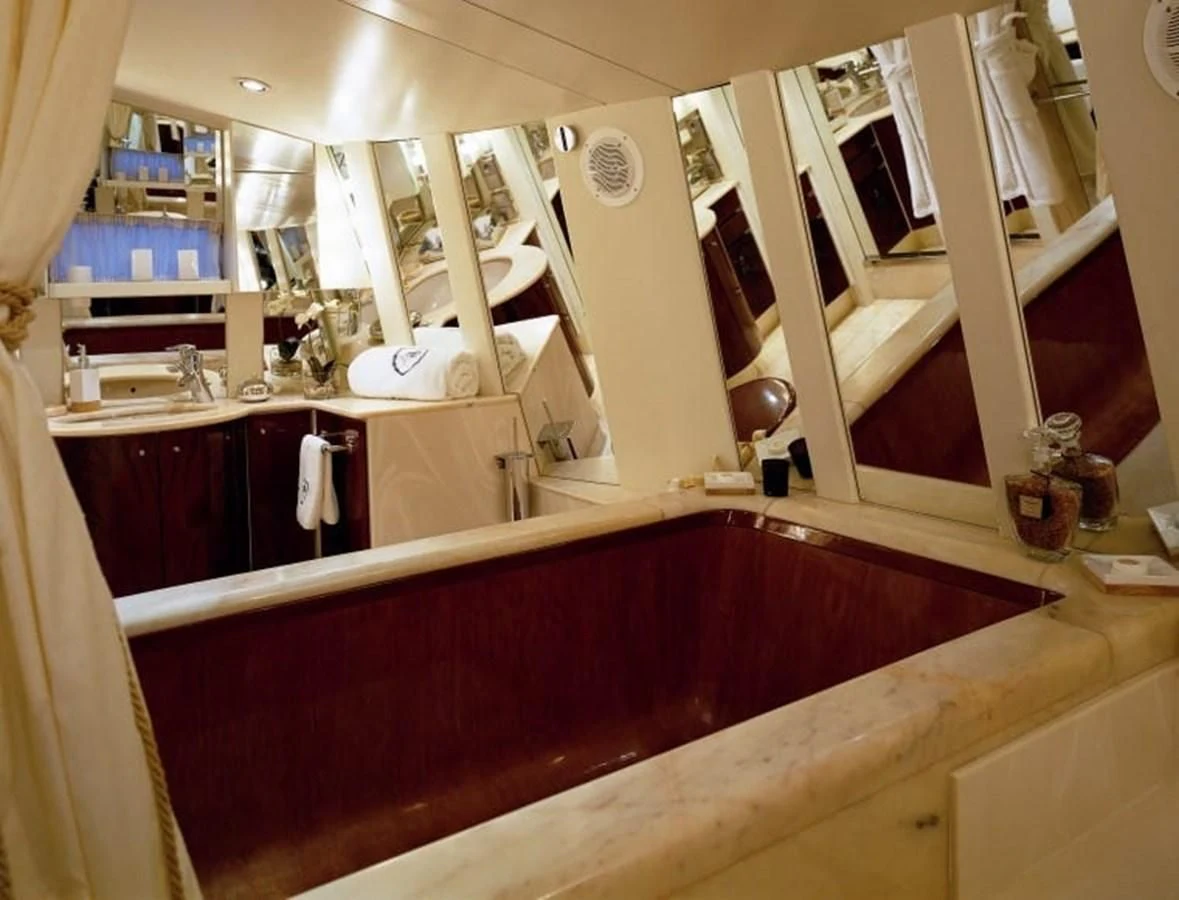 a bathroom with a red tub aboard COSTA MAGNA Yacht for Sale