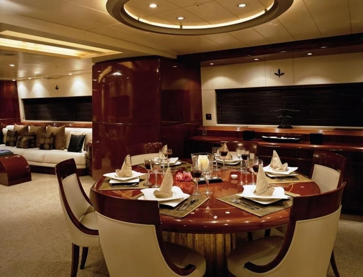 a dining room with a table and chairs aboard COSTA MAGNA Yacht for Sale