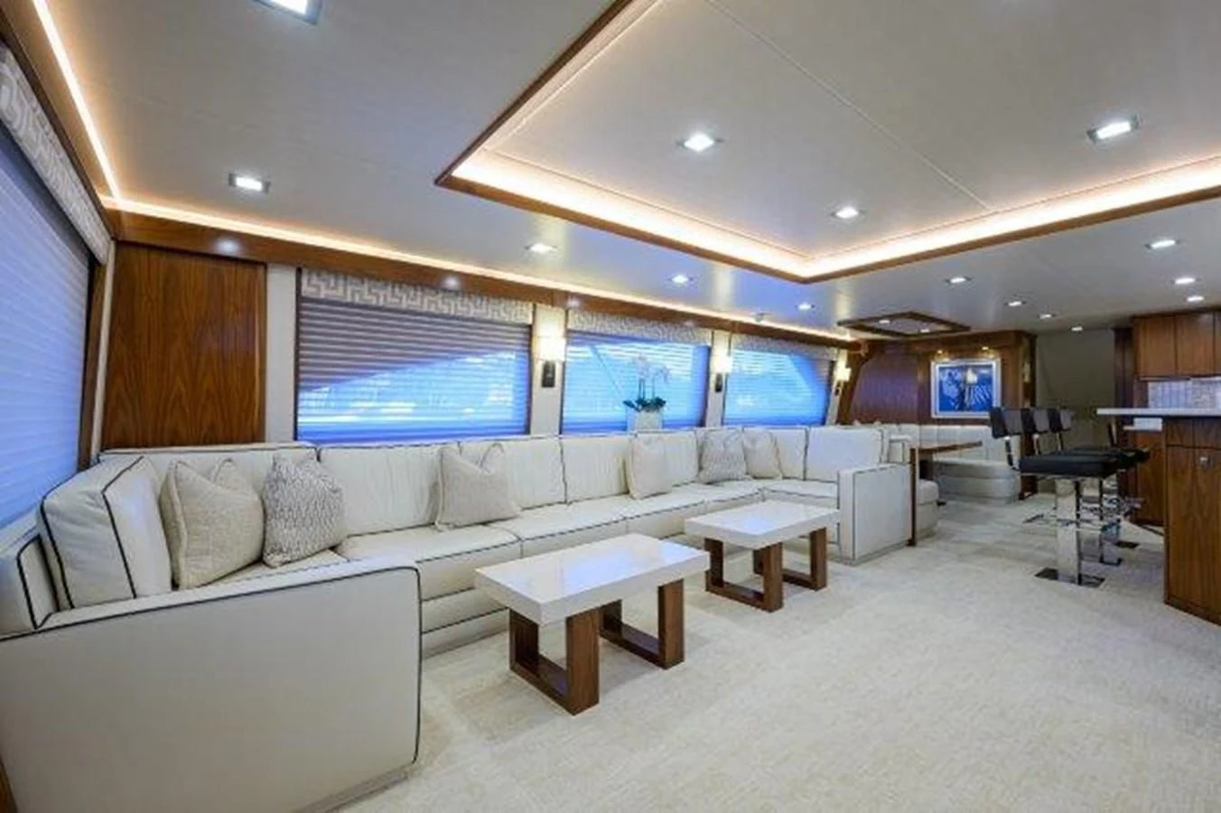 a large room with a couch and a tv aboard PASTIME Yacht for Sale