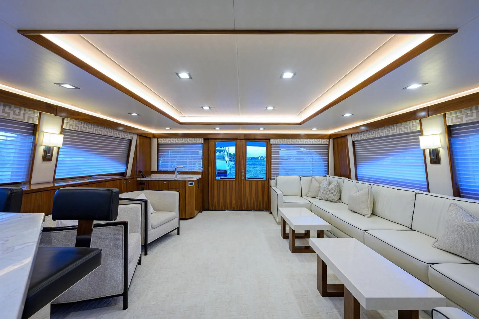 a room with a couch and a table and chairs aboard PASTIME Yacht for Sale