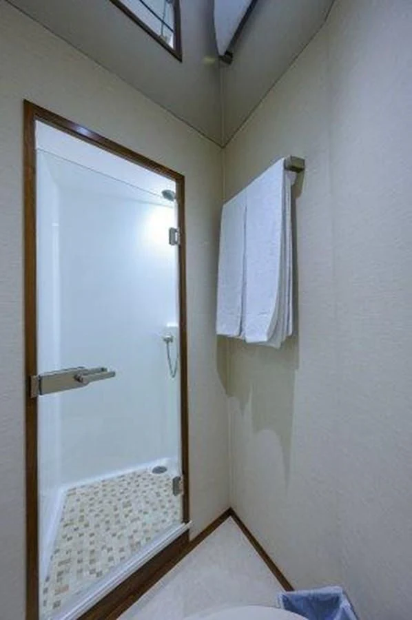 a bathroom with a white towel on the wall aboard PASTIME Yacht for Sale