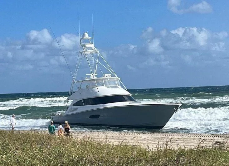 a boat on the beach aboard PASTIME Yacht for Sale