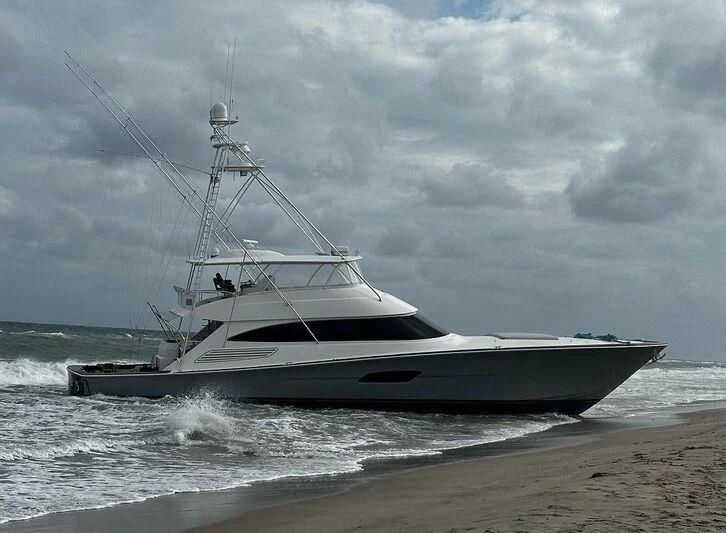 a boat on the beach aboard PASTIME Yacht for Sale