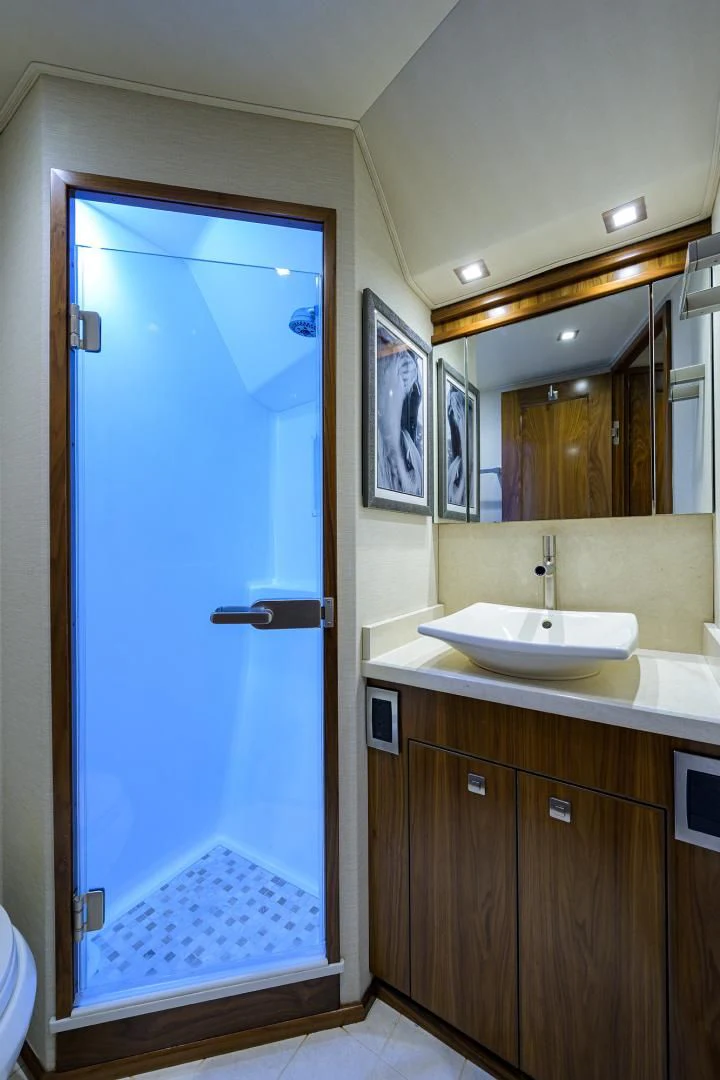 a bathroom with a blue door aboard PASTIME Yacht for Sale