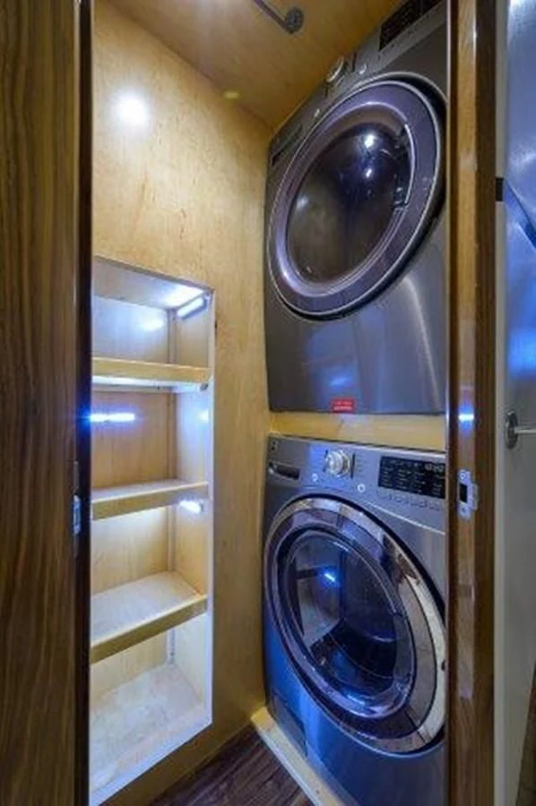 a washer and dryer in a room aboard PASTIME Yacht for Sale