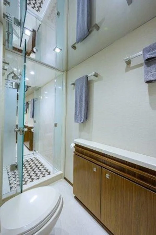 a bathroom with a glass shower aboard PASTIME Yacht for Sale