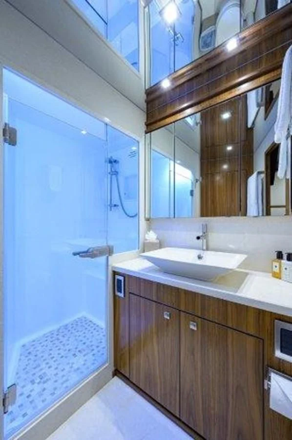 a bathroom with a sink and a mirror aboard PASTIME Yacht for Sale