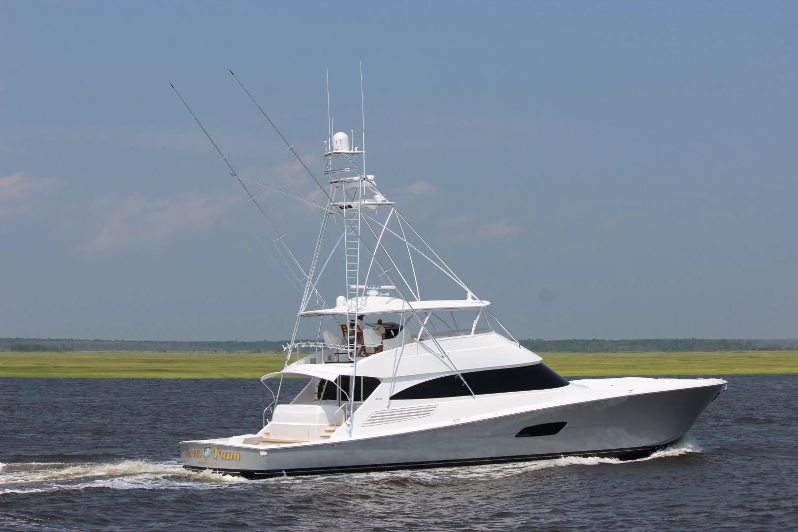 a white boat on the water aboard PASTIME Yacht for Sale