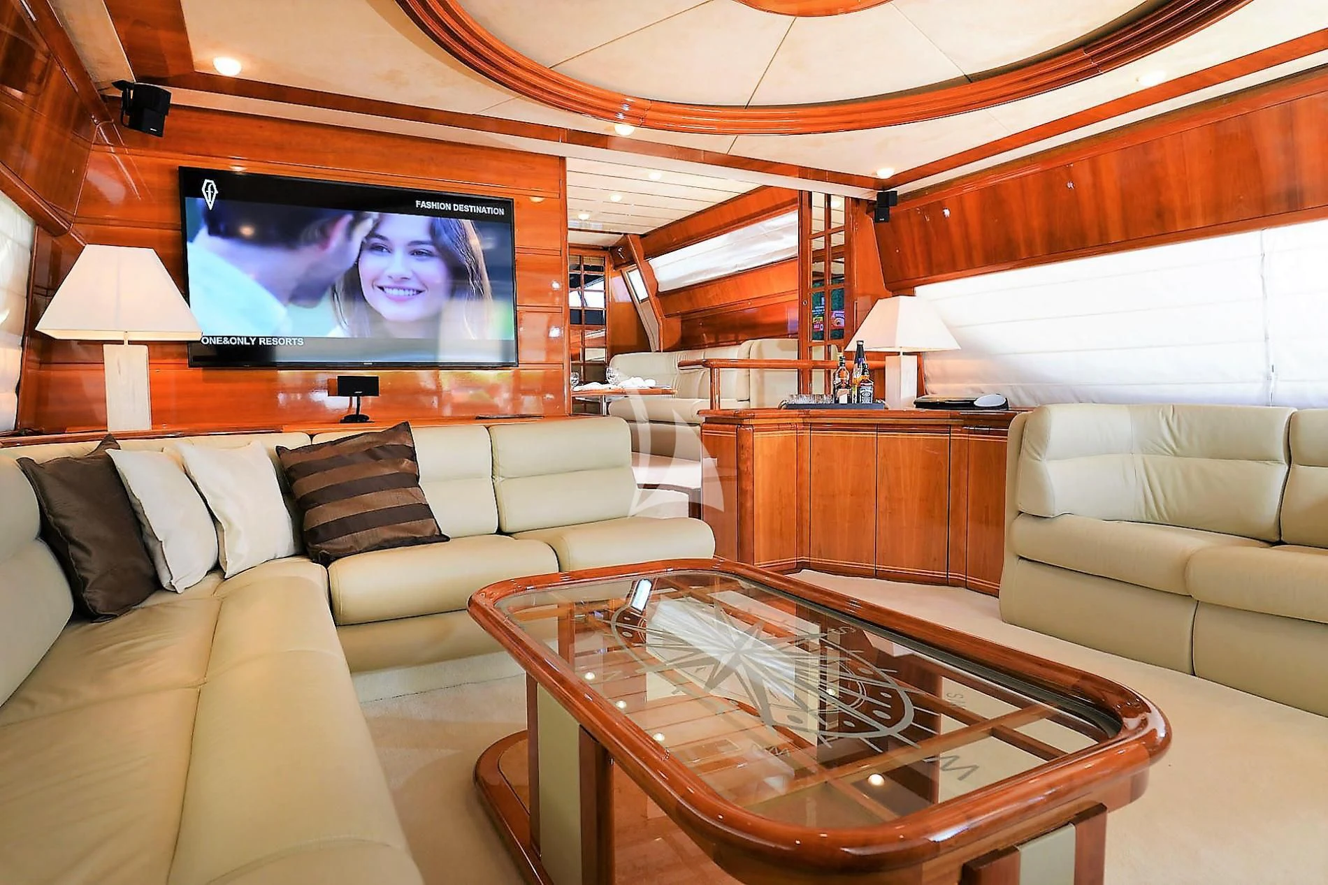 a living room with a large television aboard KENTAVROS II Yacht for Charter