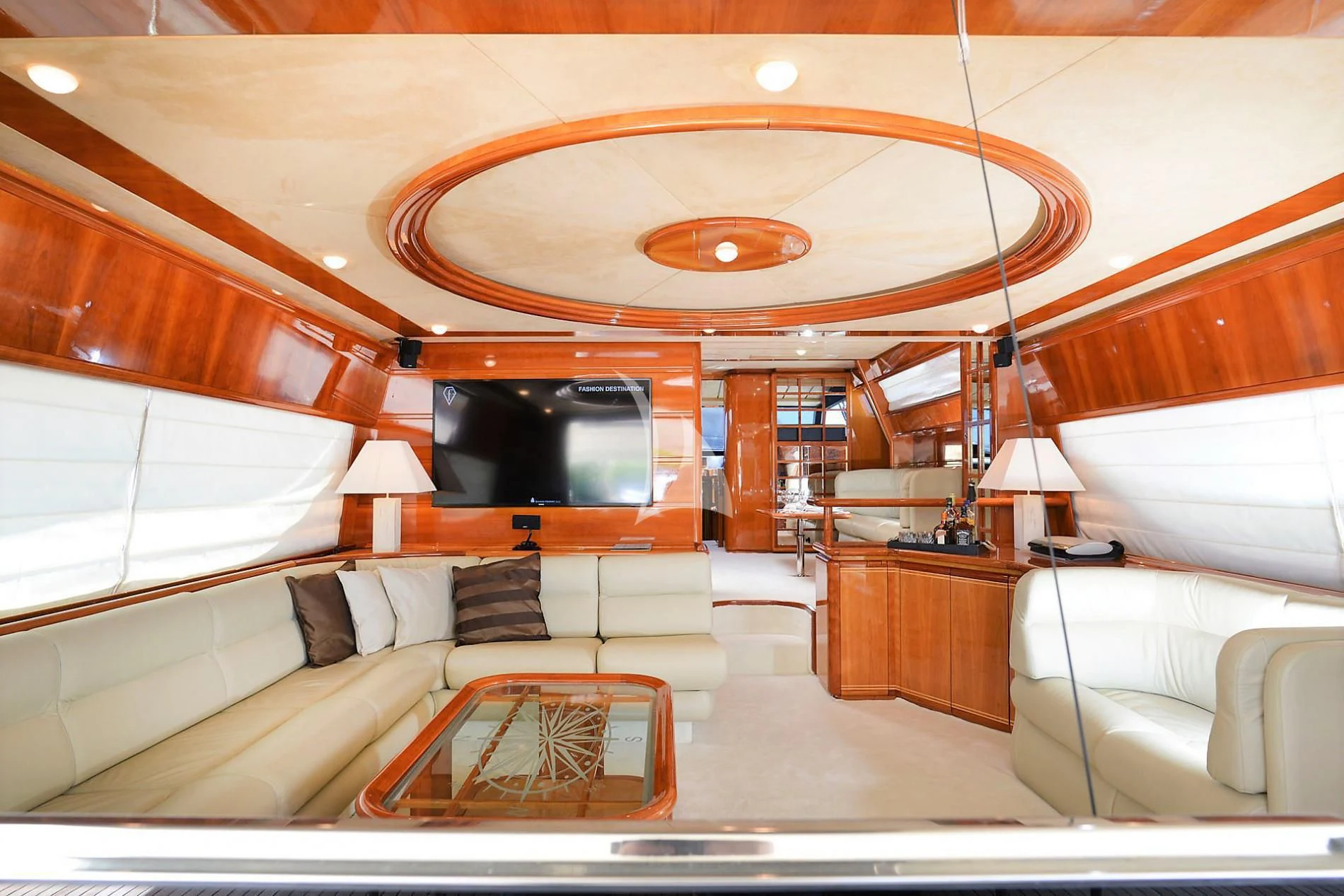 a living room with a large mirror aboard KENTAVROS II Yacht for Charter