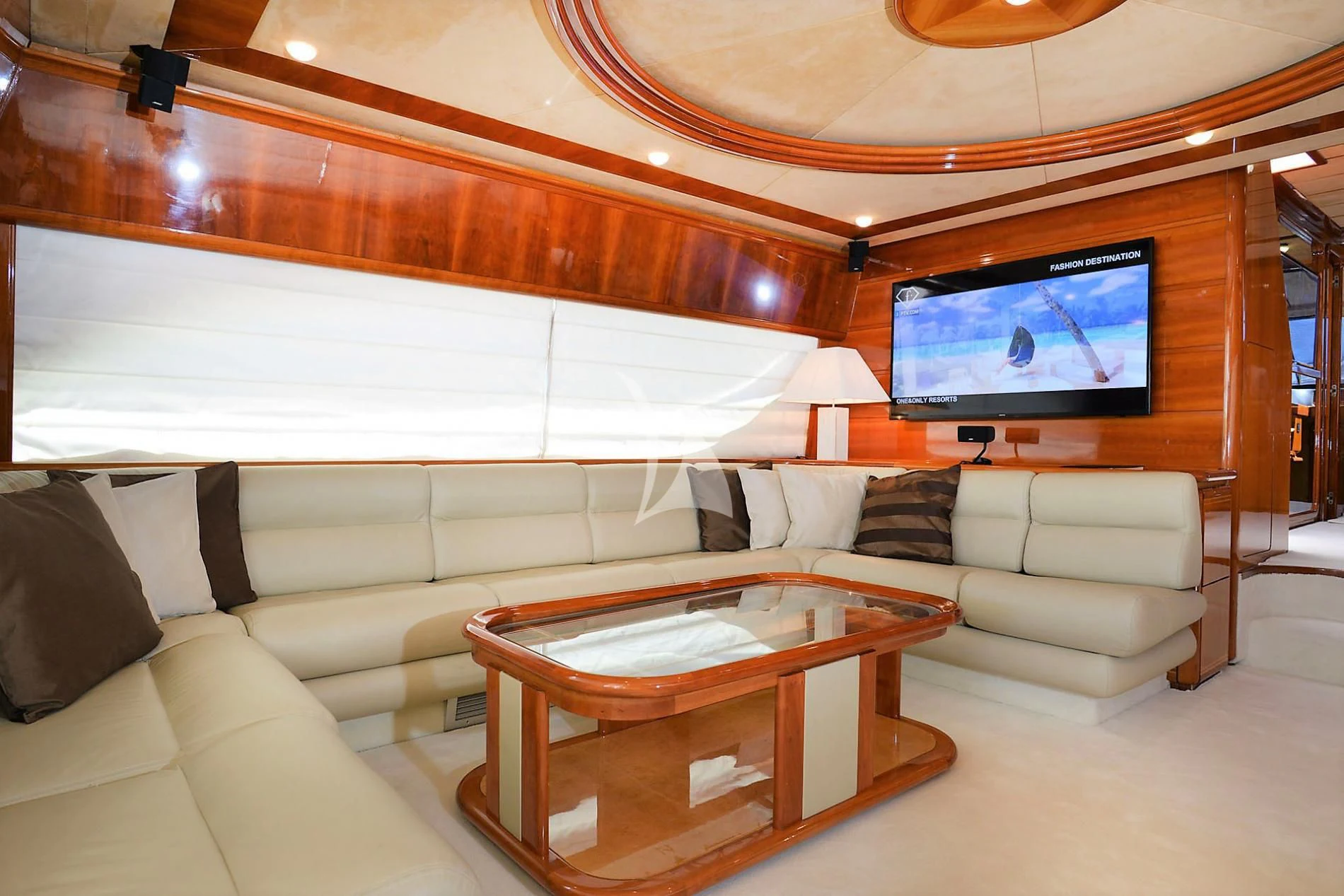a living room with a large television aboard KENTAVROS II Yacht for Charter