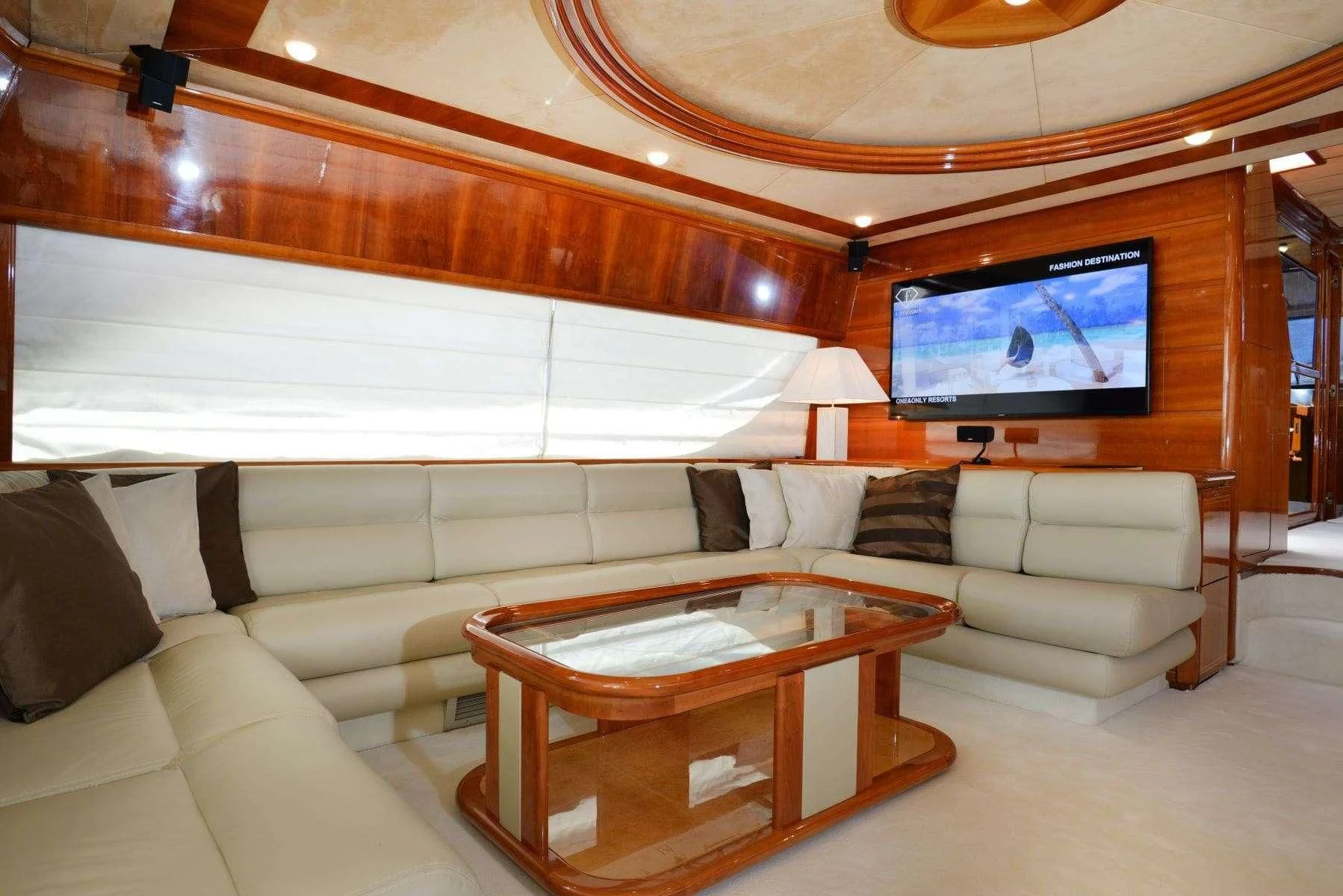 a living room with a large television aboard KENTAVROS II Yacht for Charter