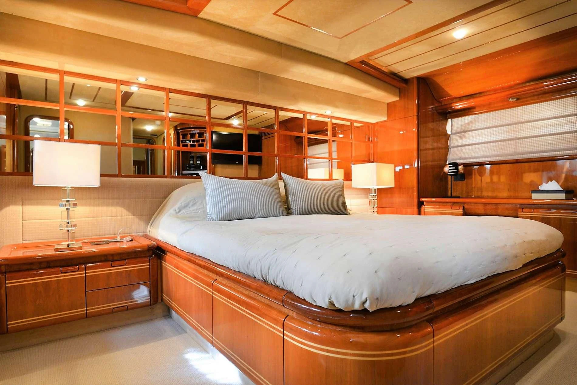 a large bed in a room aboard KENTAVROS II Yacht for Charter