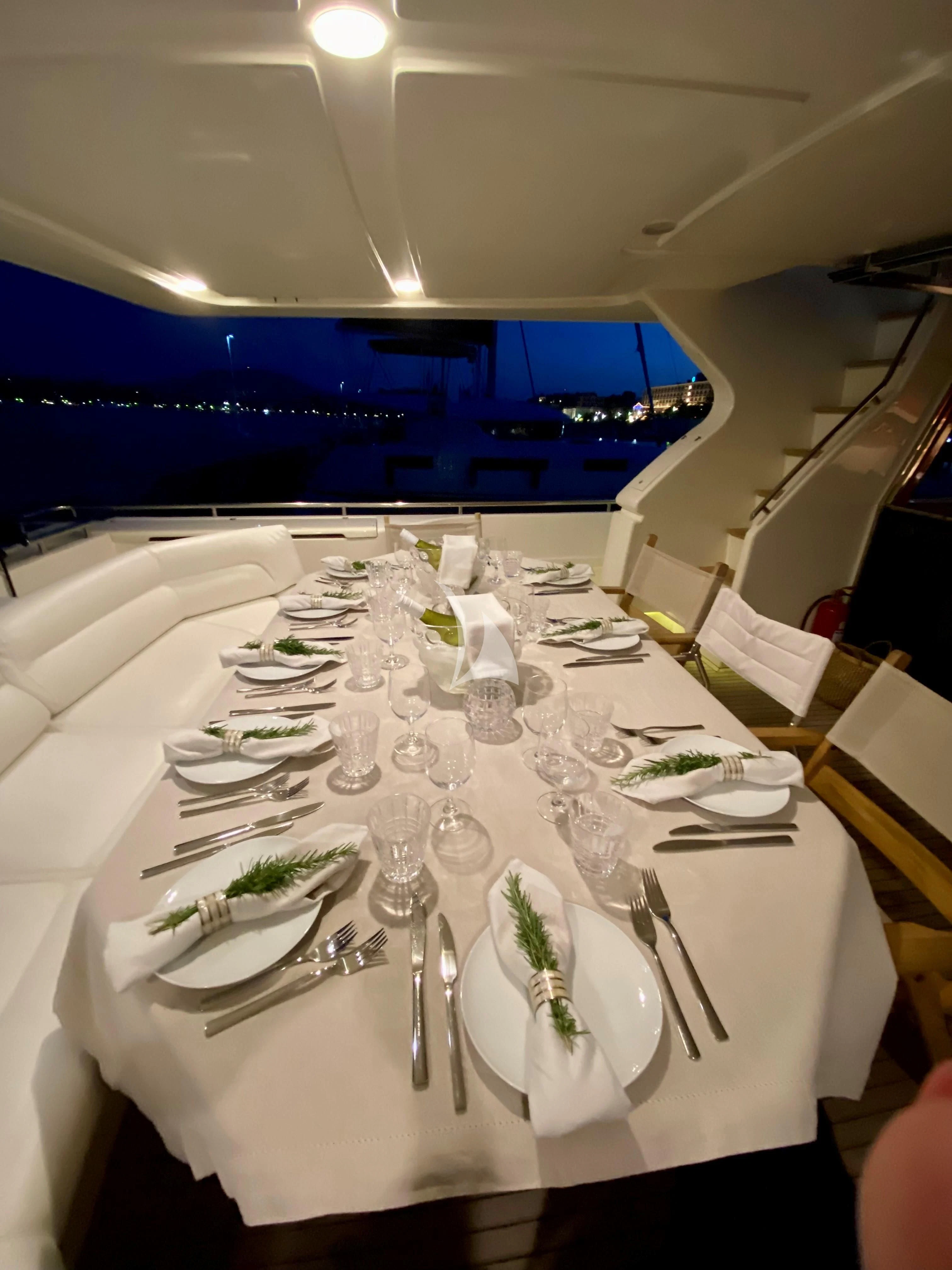 a table set for a dinner aboard KENTAVROS II Yacht for Charter