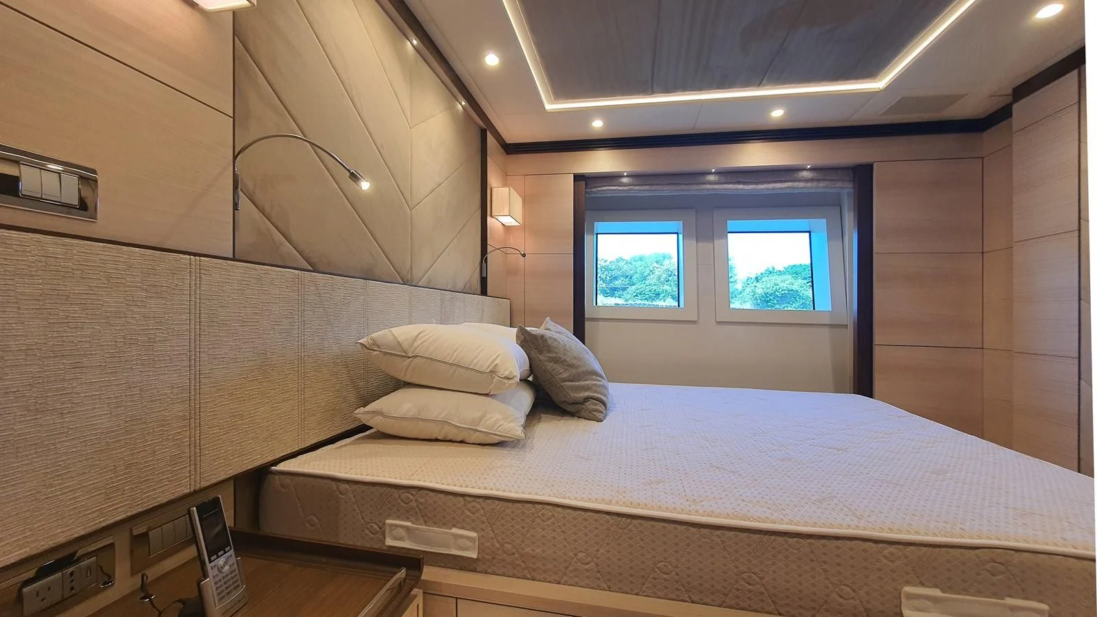 a bed in a room aboard CALYPSO Yacht for Charter