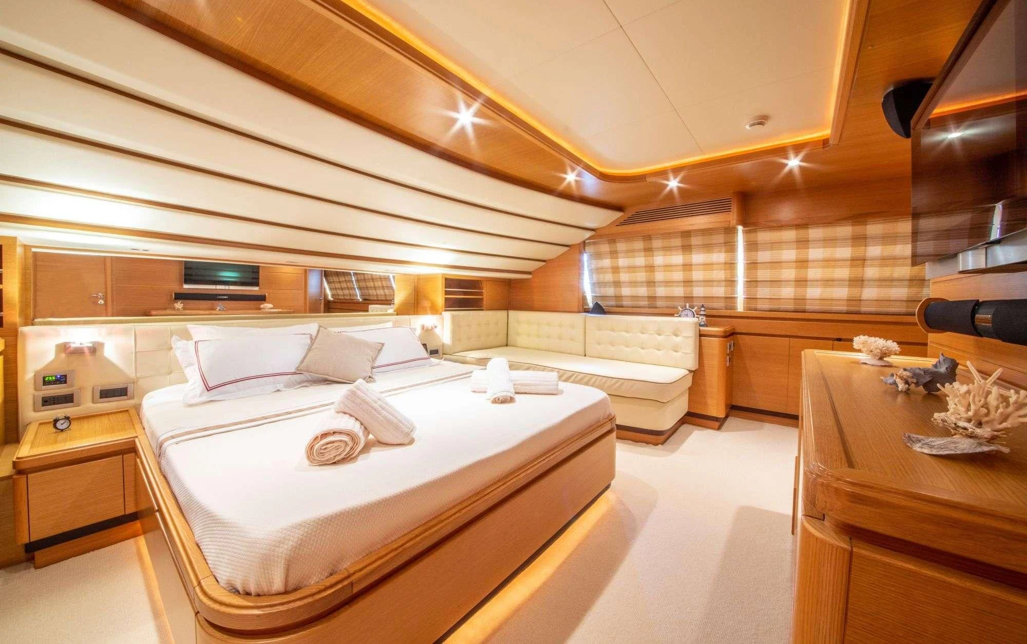 a room with a bed and a desk aboard FUNDA D Yacht for Sale