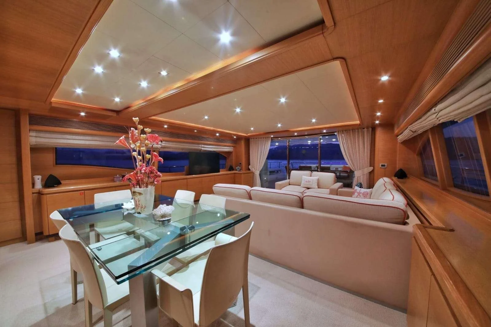 a room with a table and couch aboard FUNDA D Yacht for Sale