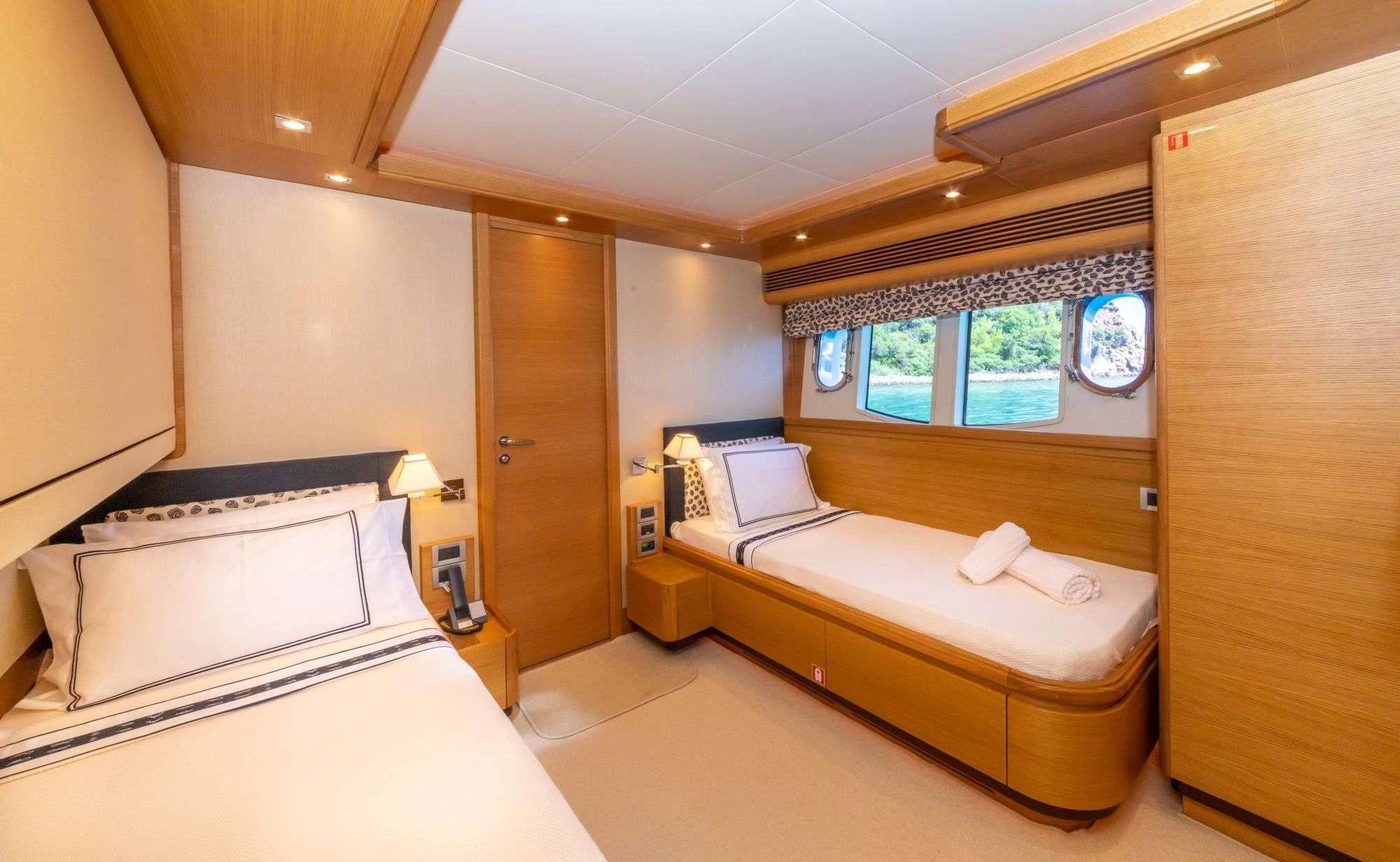 a room with two beds aboard FUNDA D Yacht for Sale
