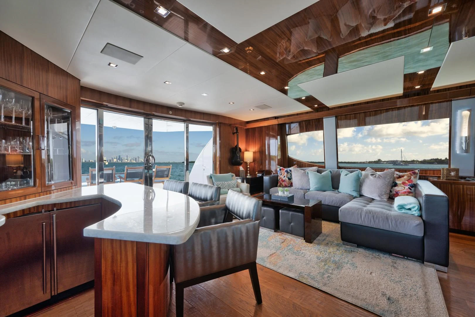 a living room with a couch and a table aboard RITZ SEA Yacht for Sale