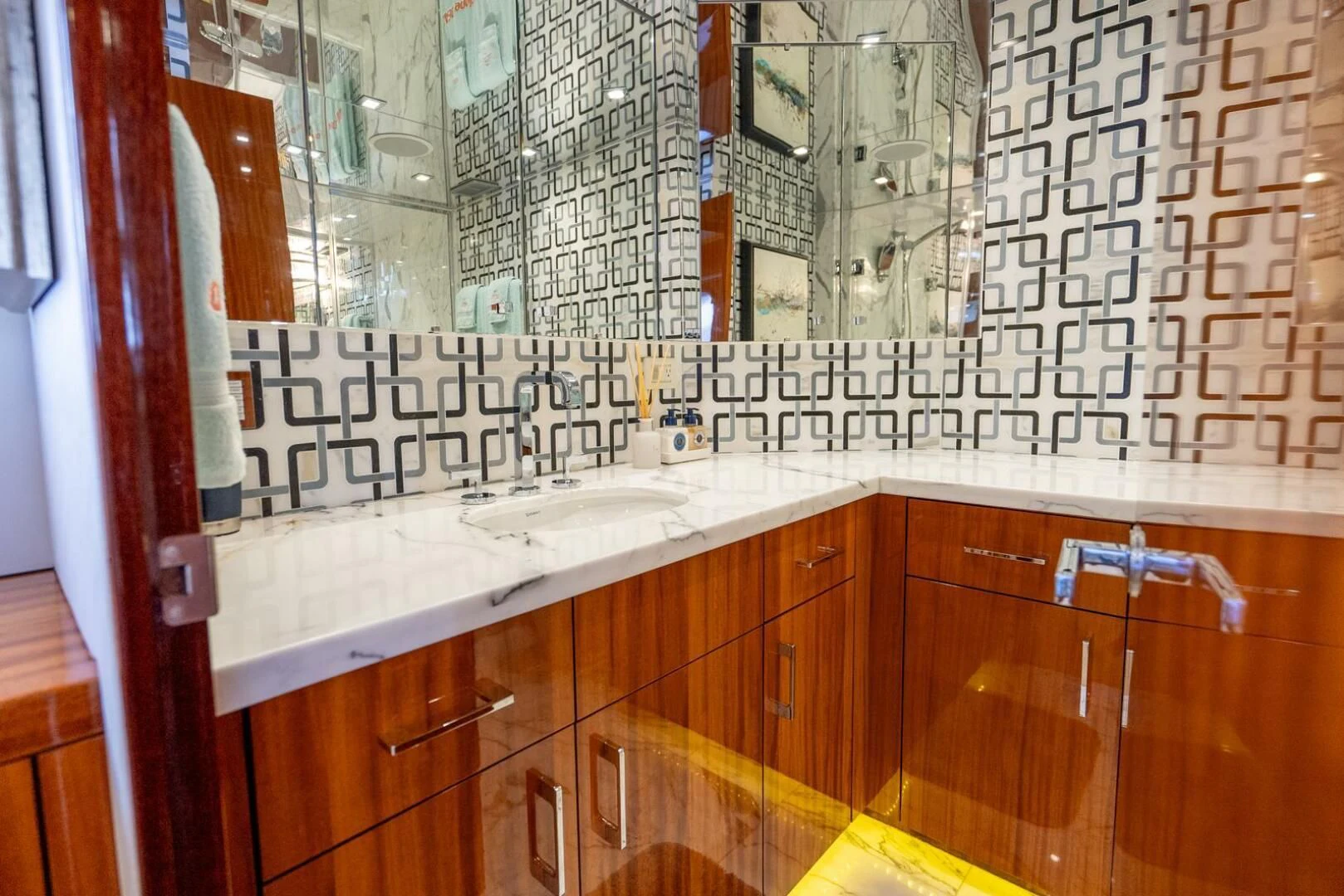 a bathroom with a countertop sink and mirror aboard RITZ SEA Yacht for Sale