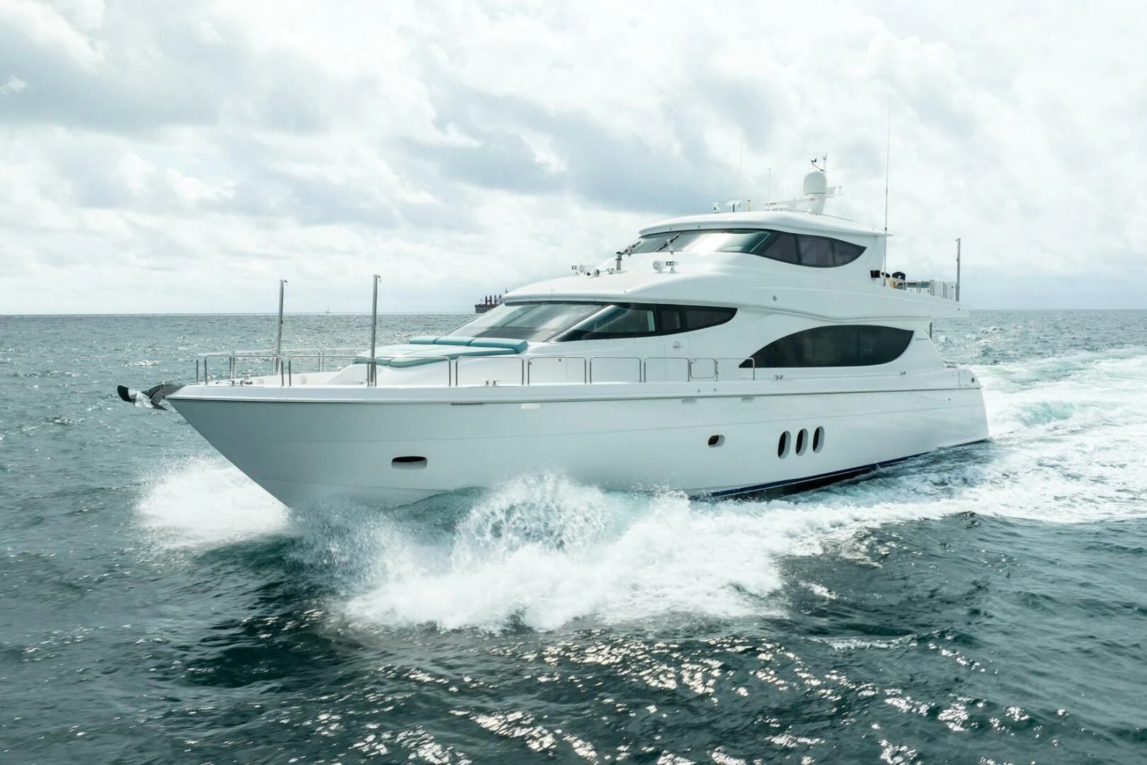a white yacht splashing in the ocean aboard RITZ SEA Yacht for Sale
