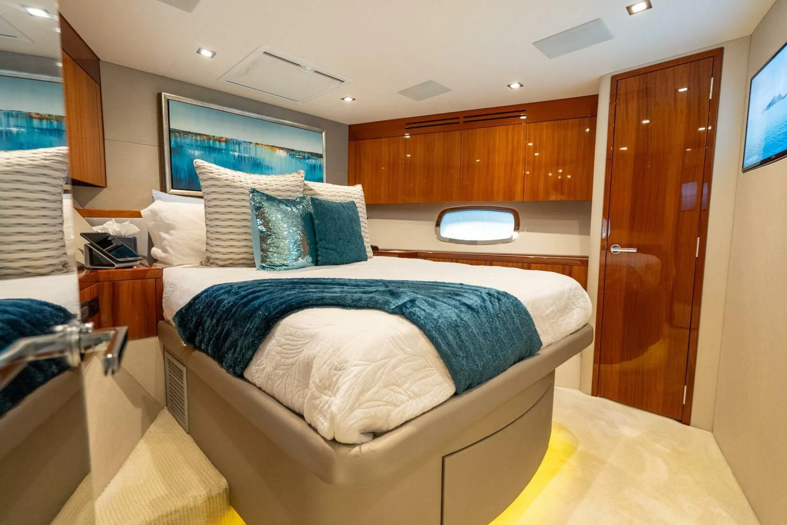 a room with a bed and a television aboard RITZ SEA Yacht for Sale