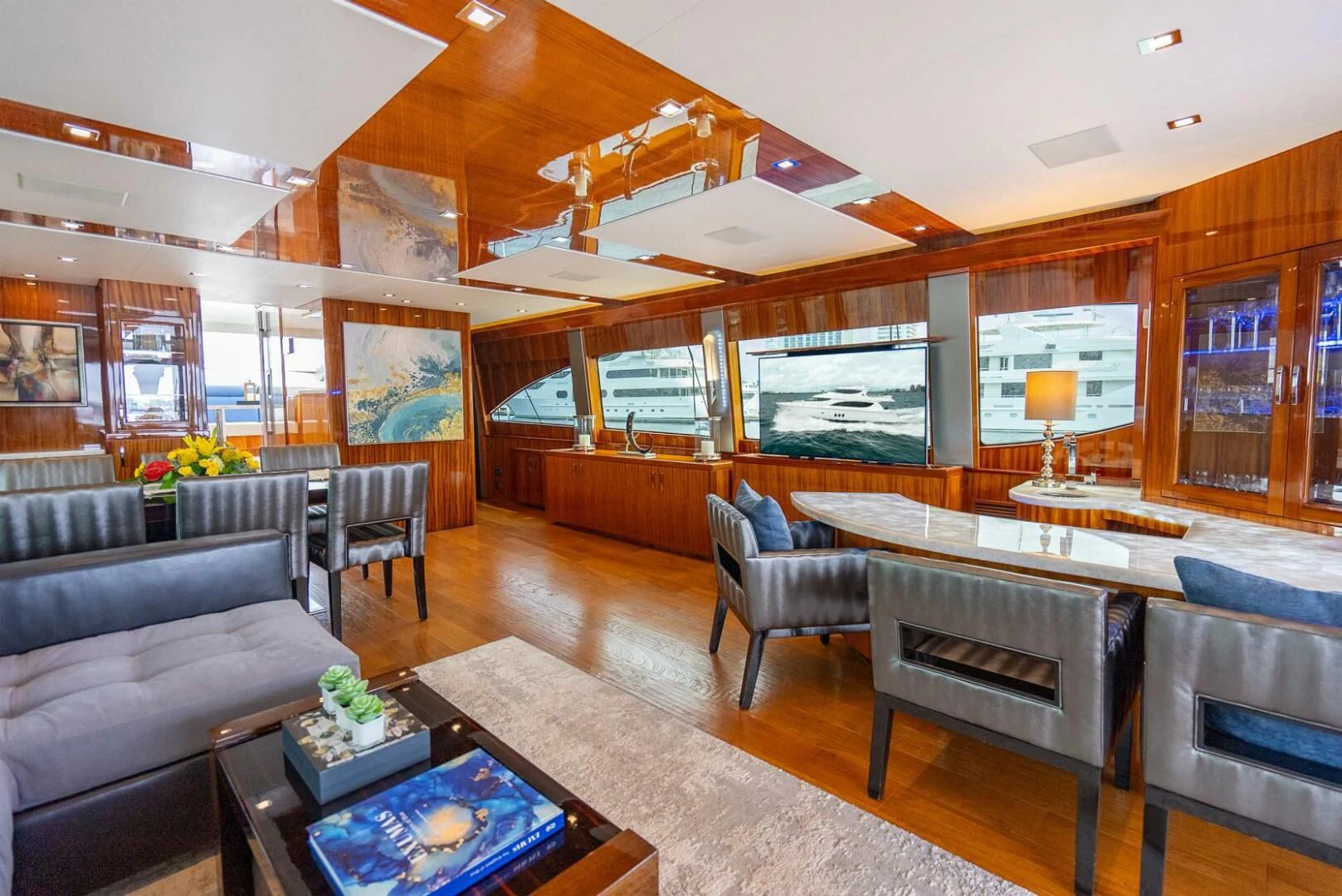 a living room with a large window aboard RITZ SEA Yacht for Sale