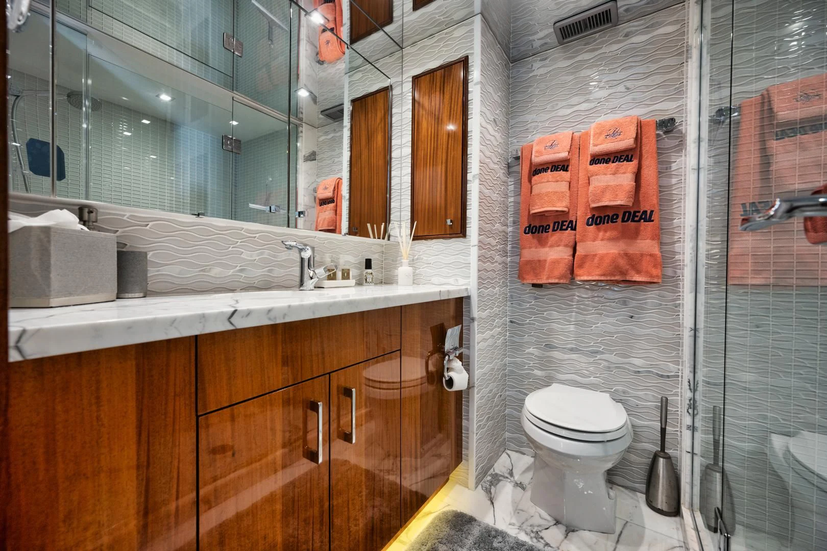 a bathroom with a toilet and a sink aboard RITZ SEA Yacht for Sale