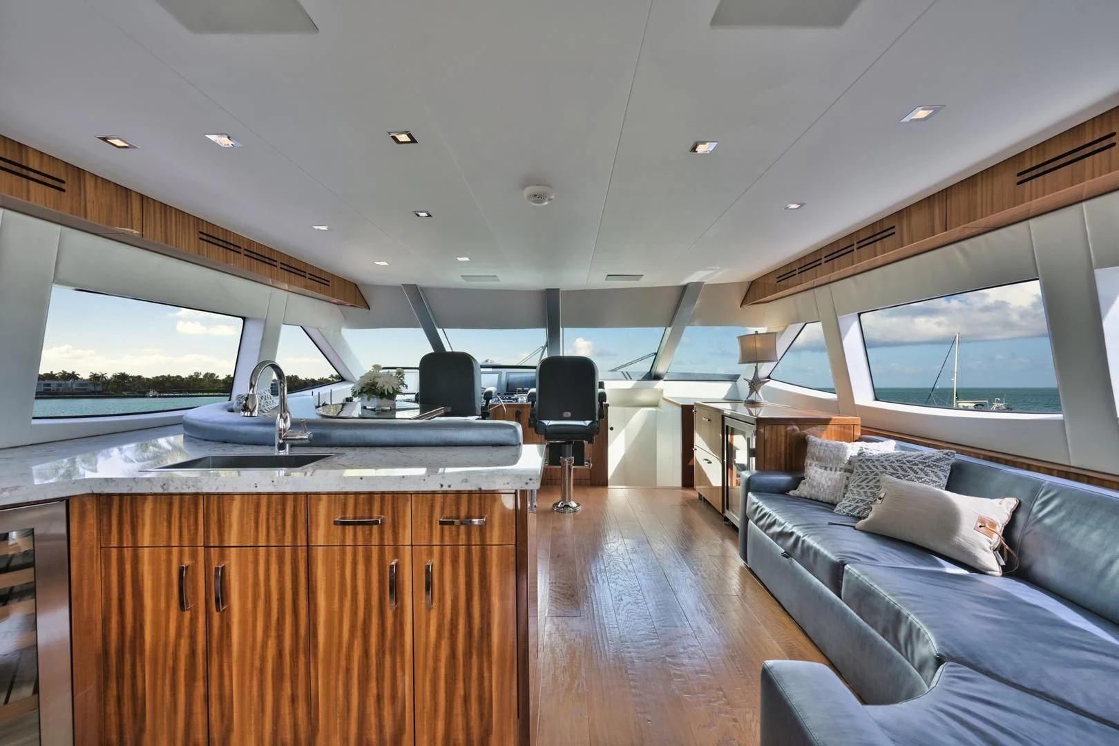 a large room with a couch and a sink in it aboard RITZ SEA Yacht for Sale