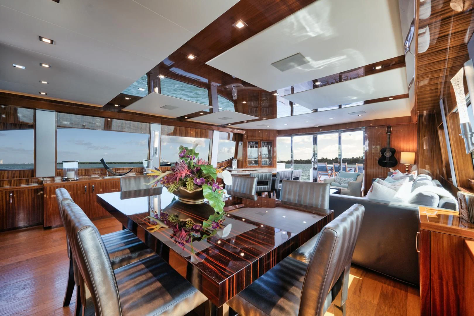 a room with a table and chairs aboard RITZ SEA Yacht for Sale