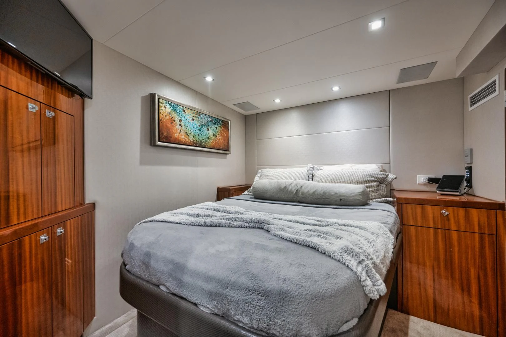 a bedroom with two beds aboard RITZ SEA Yacht for Sale