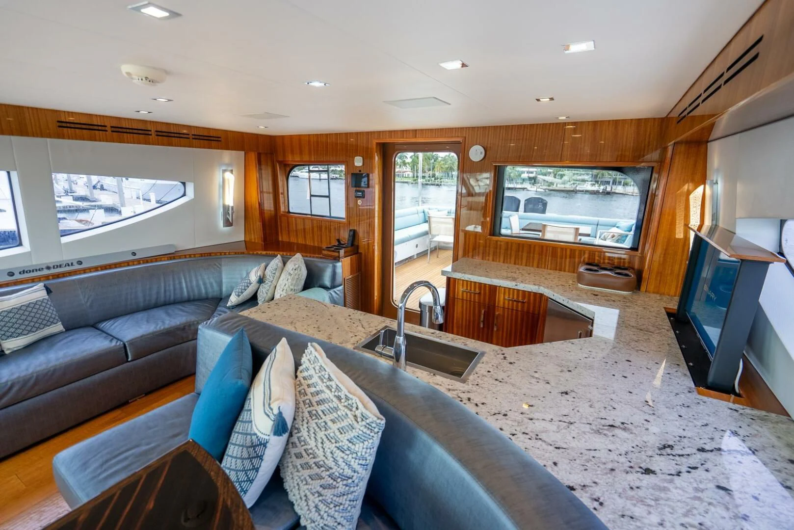 a living room with a large tv aboard RITZ SEA Yacht for Sale