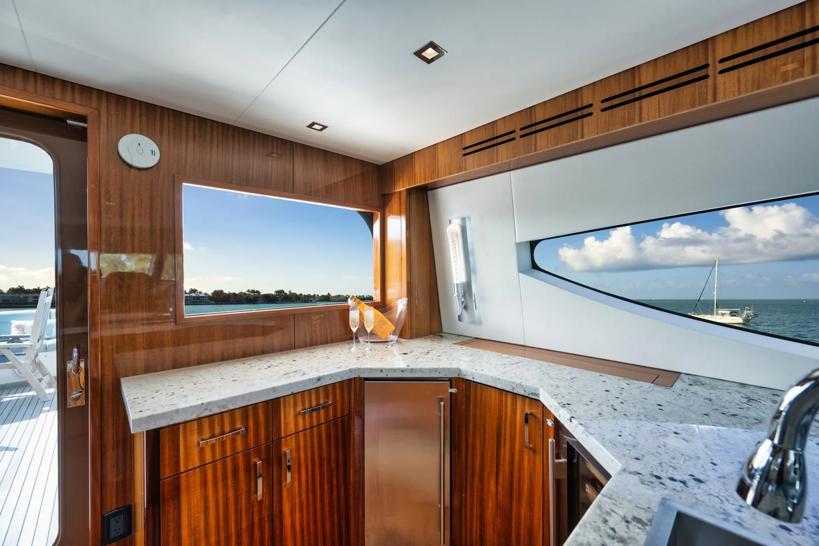 a kitchen with a large window aboard RITZ SEA Yacht for Sale