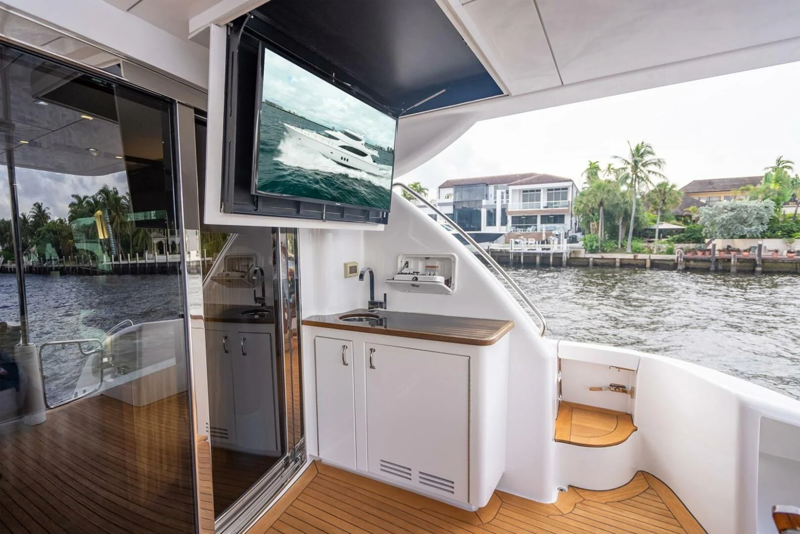 a boat with a sink and a tv on the wall aboard RITZ SEA Yacht for Sale