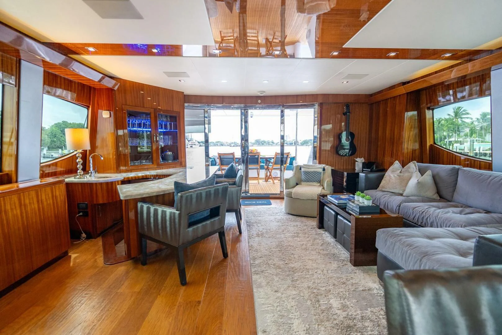 a living room with a large window aboard RITZ SEA Yacht for Sale