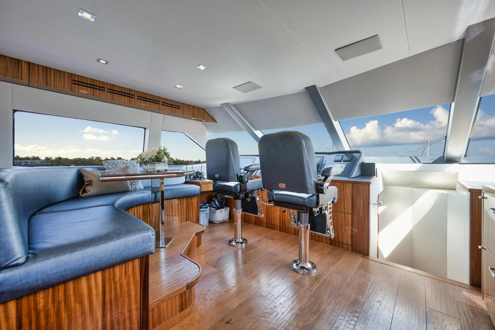 a room with a couch and a table and a tv aboard RITZ SEA Yacht for Sale