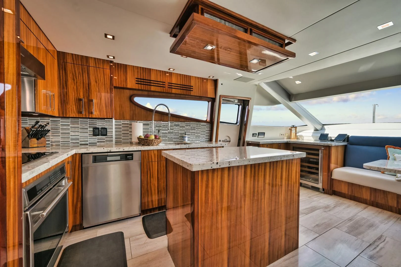 a kitchen with wooden cabinets aboard RITZ SEA Yacht for Sale