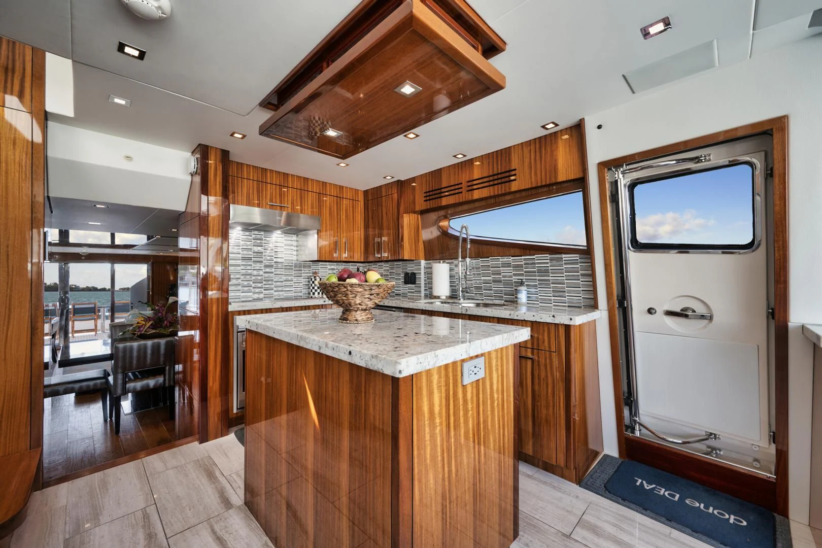 a kitchen with wooden cabinets aboard RITZ SEA Yacht for Sale
