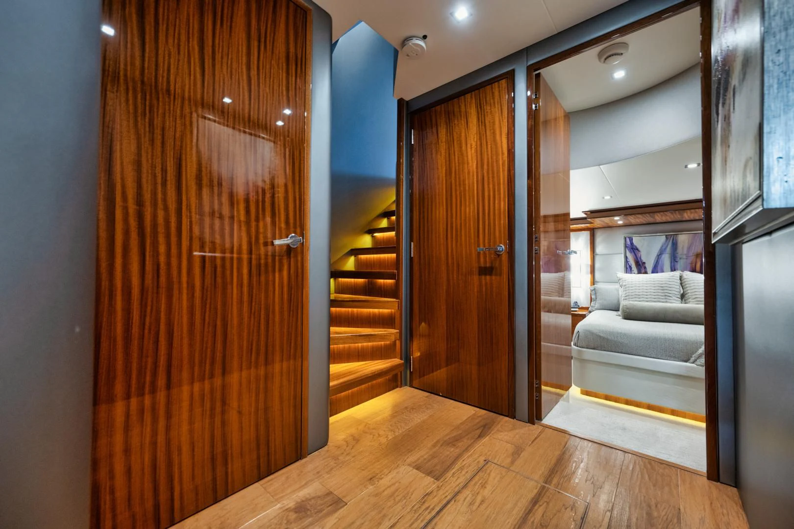a room with a wood door and a couch aboard RITZ SEA Yacht for Sale