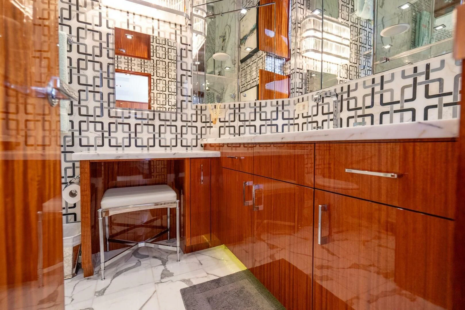 a room with a desk and a chair aboard RITZ SEA Yacht for Sale