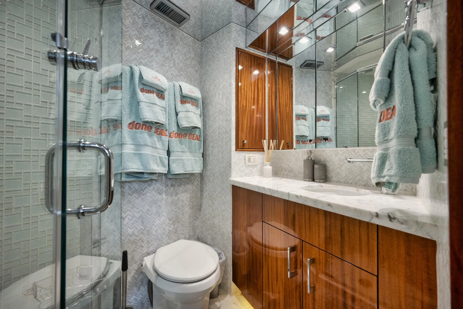 a bathroom with a glass shower aboard RITZ SEA Yacht for Sale