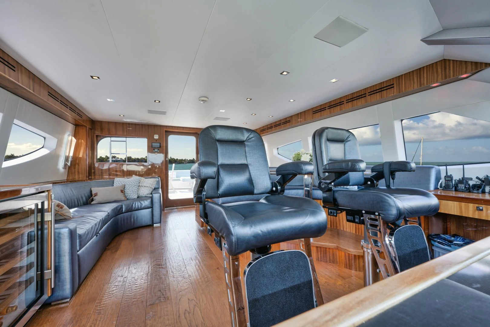 a living room with leather chairs and a couch aboard RITZ SEA Yacht for Sale