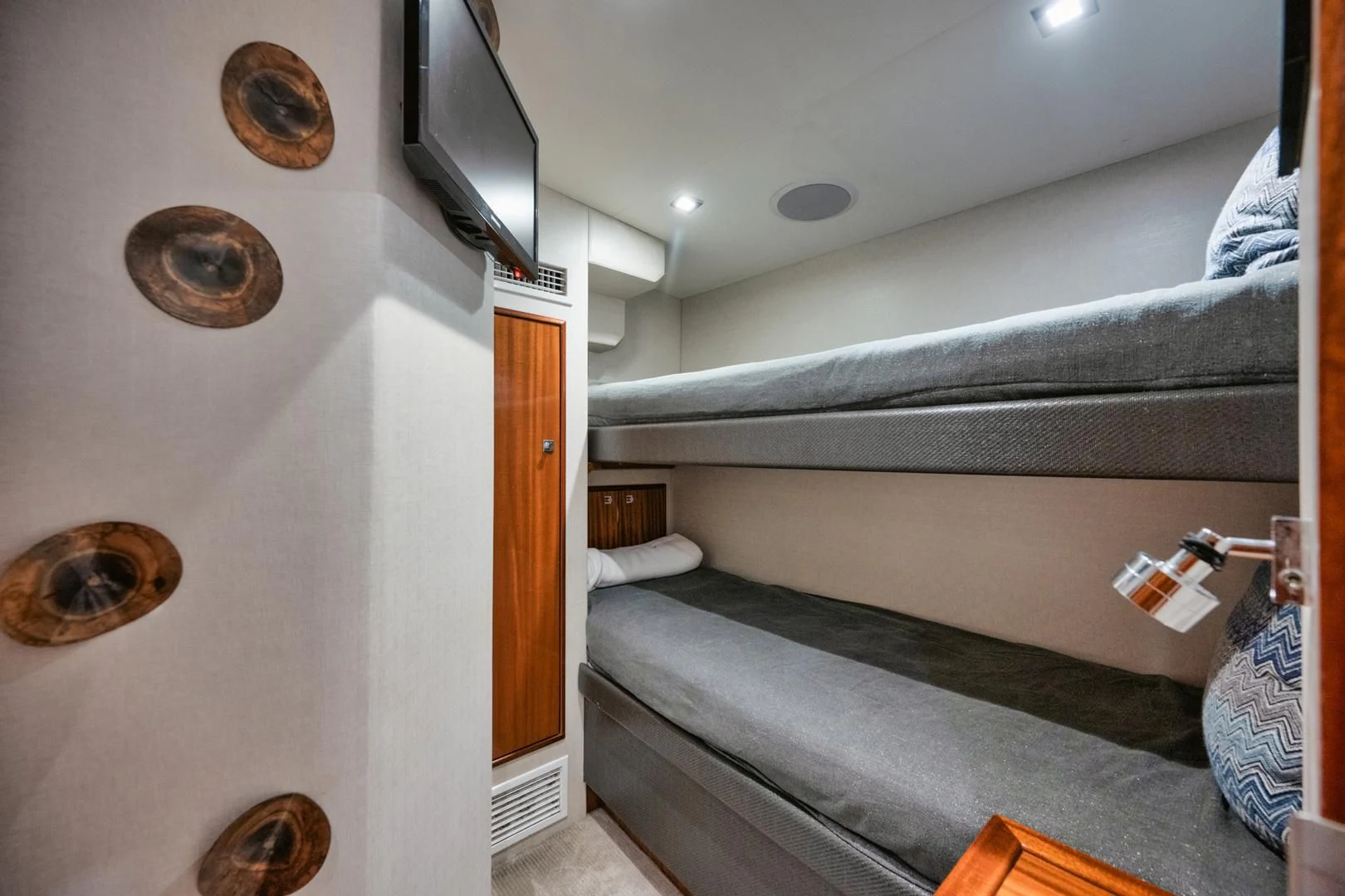 a room with a bed and a television aboard RITZ SEA Yacht for Sale