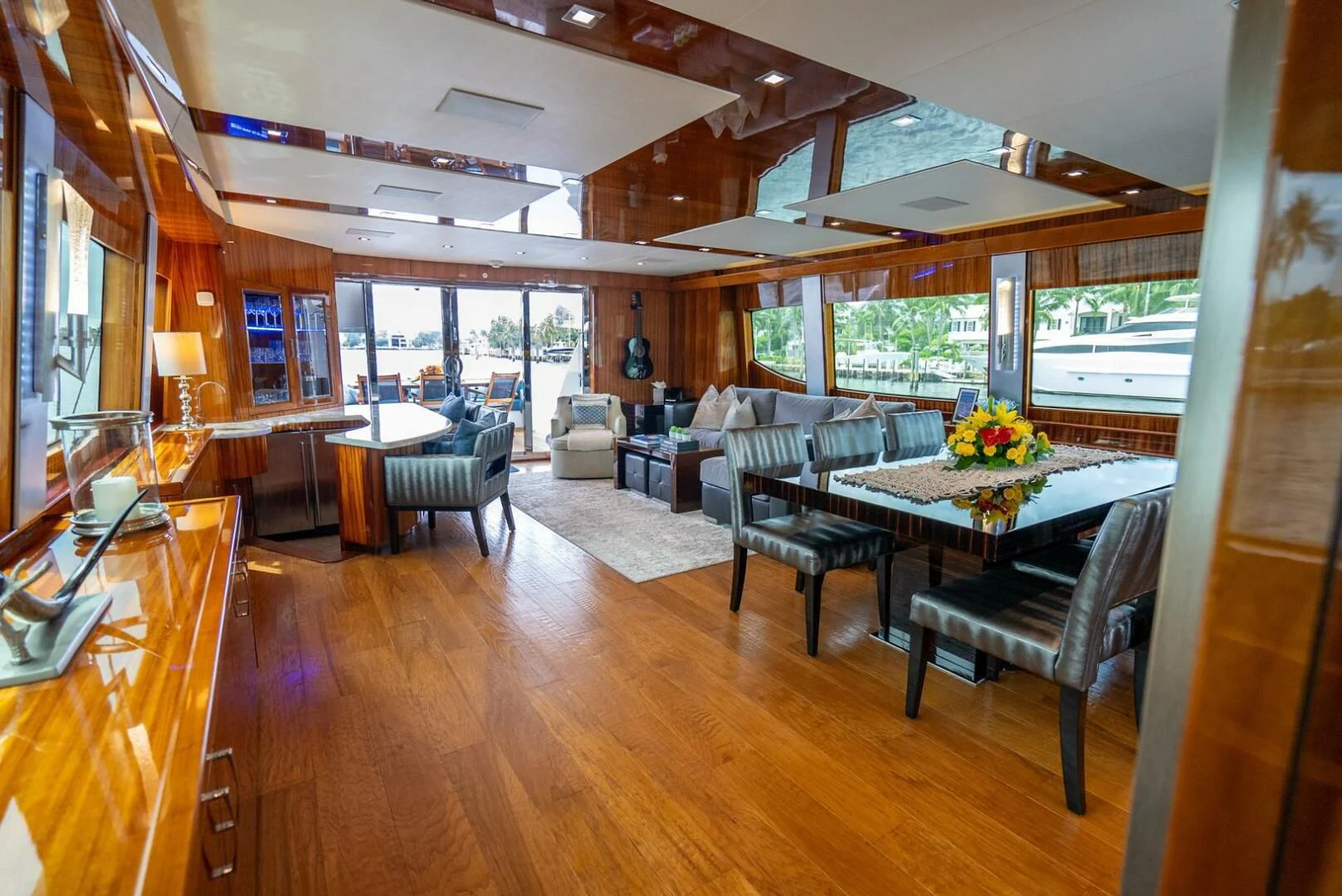 a room with a table chairs and a large window aboard RITZ SEA Yacht for Sale