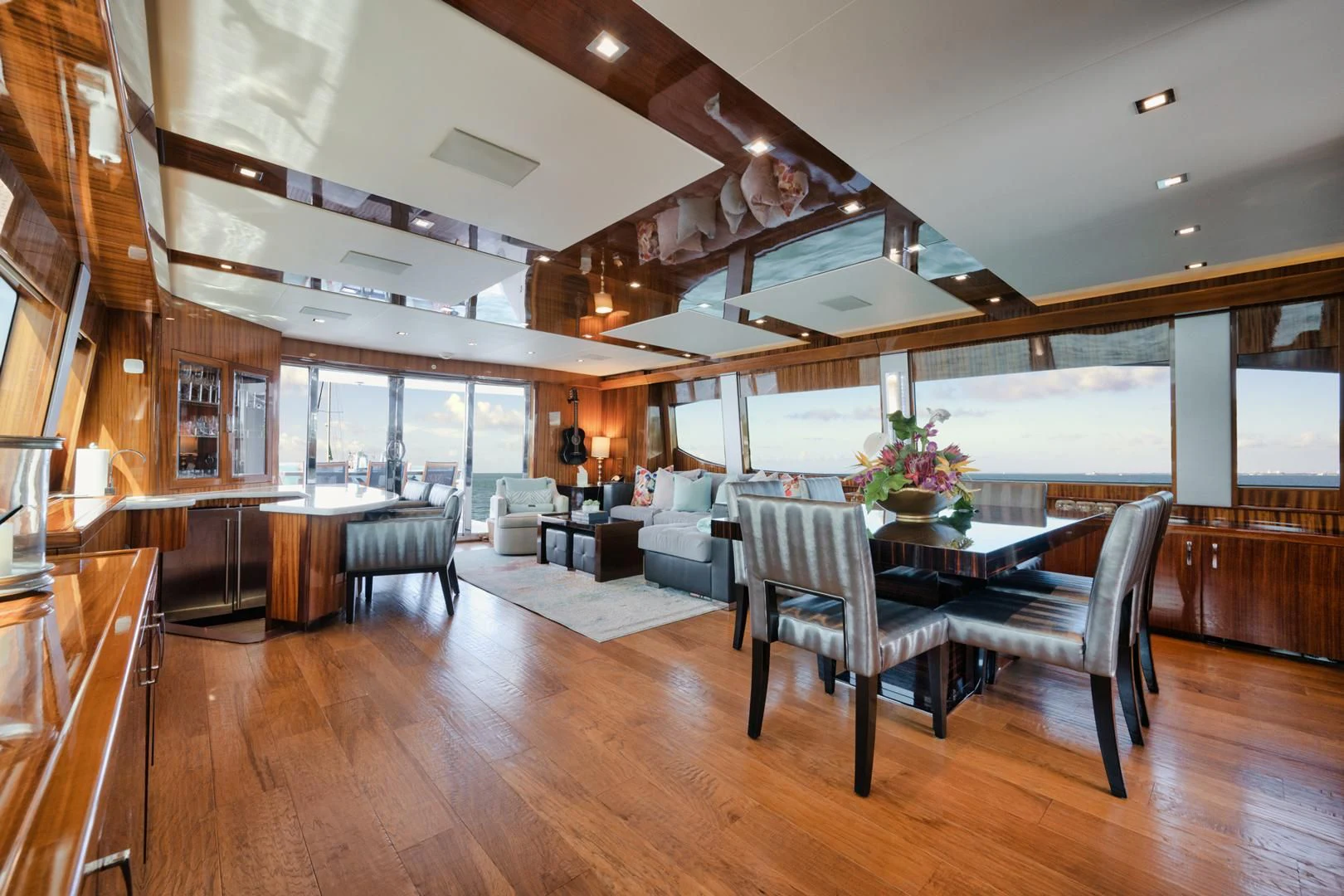 a room with a table and chairs aboard RITZ SEA Yacht for Sale