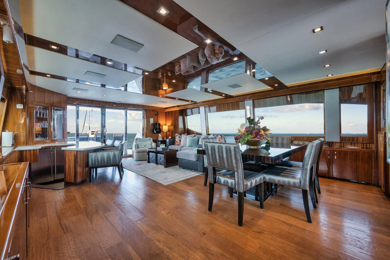a room with a table and chairs aboard RITZ SEA Yacht for Sale