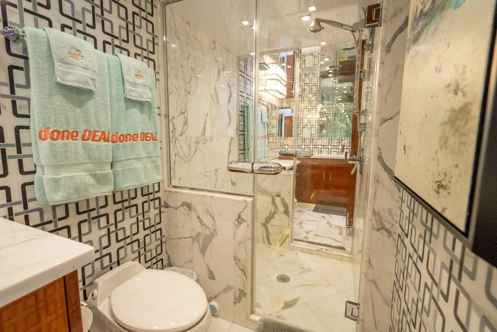 a bathroom with a toilet and a sink aboard RITZ SEA Yacht for Sale