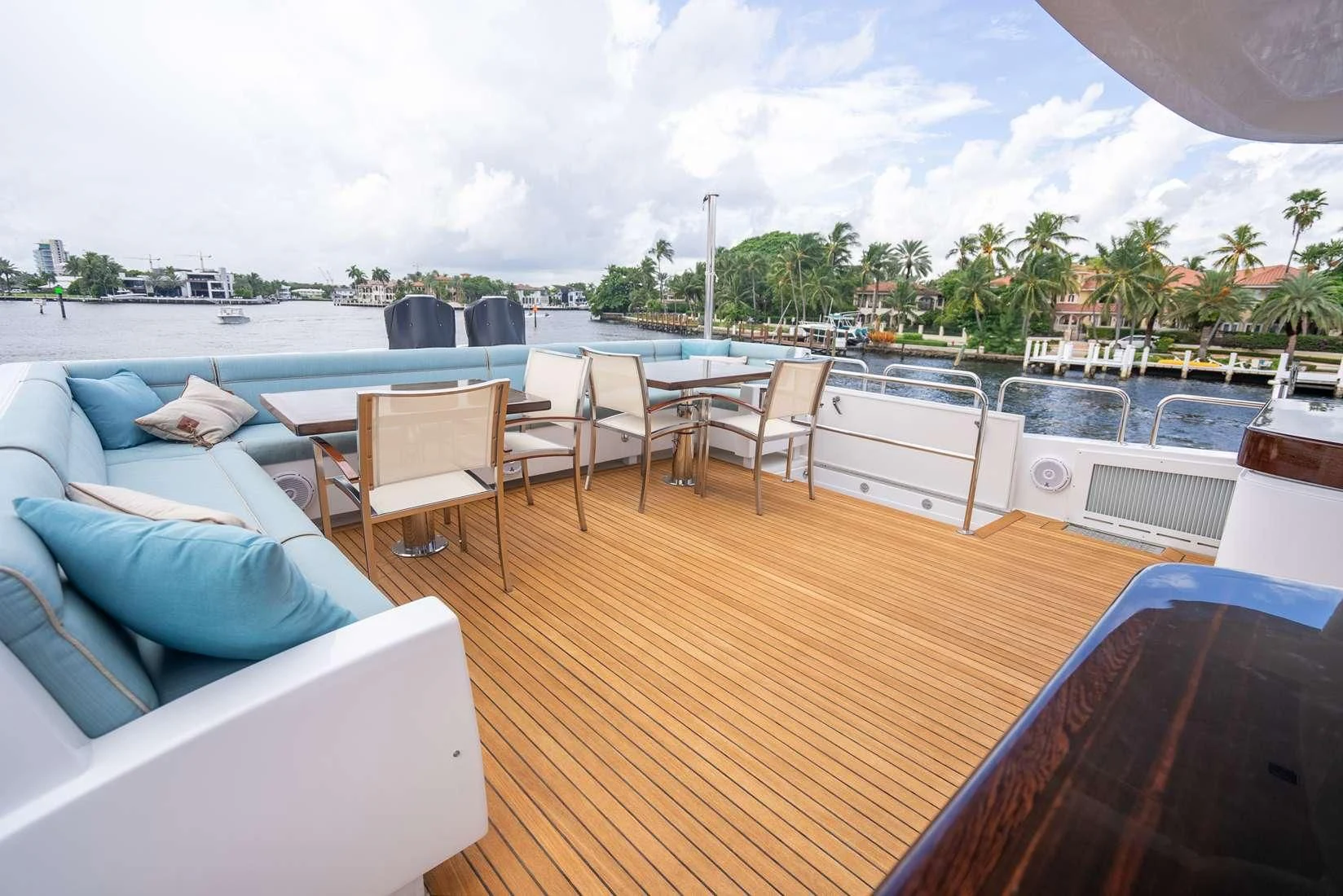 a deck with a pool and a deck with chairs and trees aboard RITZ SEA Yacht for Sale