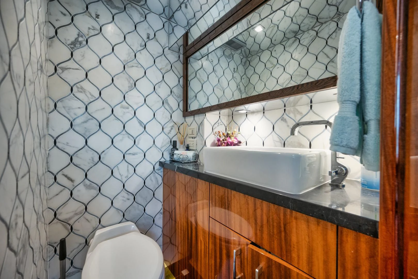 a bathroom with a sink and mirror aboard RITZ SEA Yacht for Sale